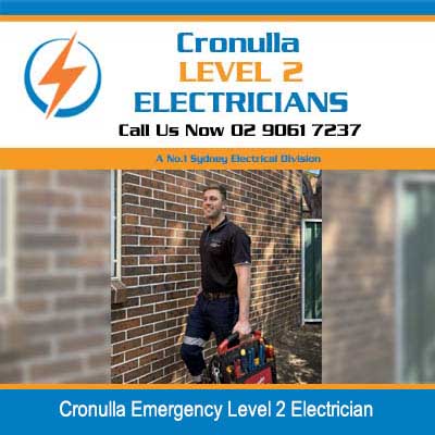 Emergency level 2 electrician working on outdoor electrical outlet on brick wall in Cronulla