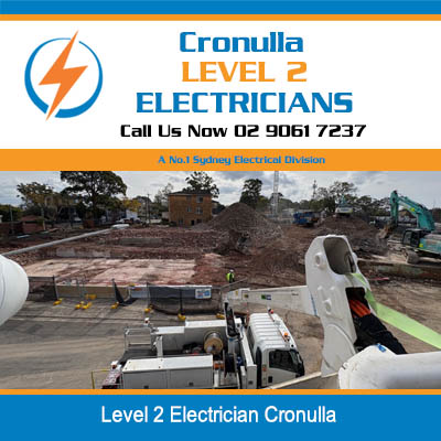 Level 2 electrician in cherry picker bucket working on overhead power lines in Cronulla